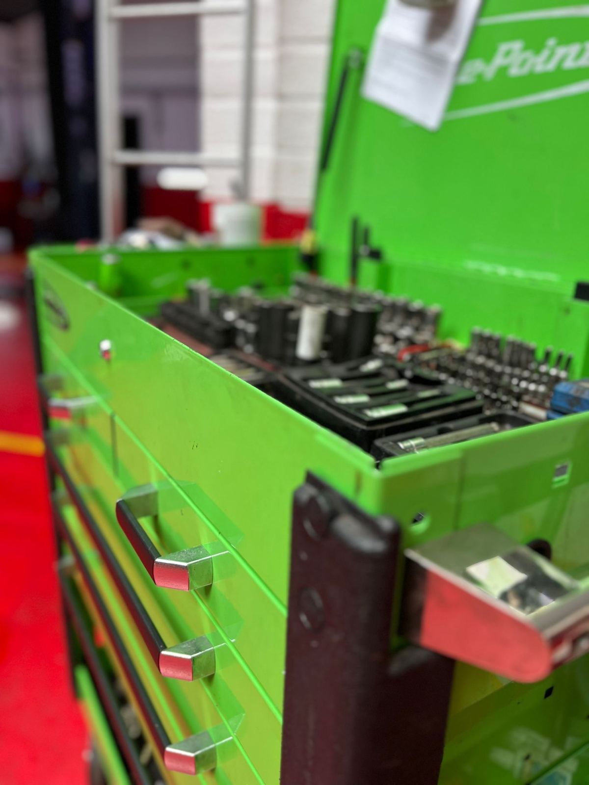 A tidy green tool chest in the workshop